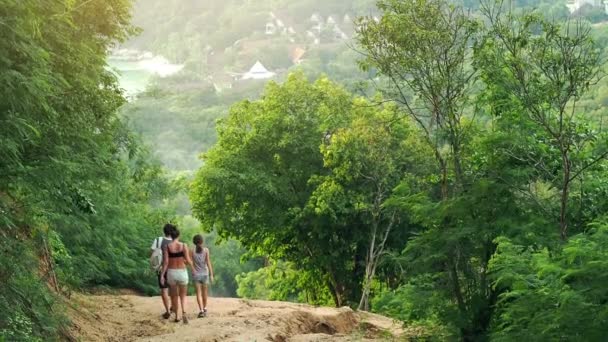 People trekking through hills — Stock Video