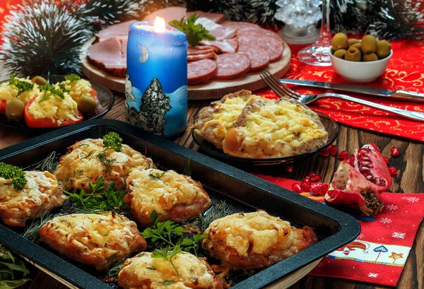 Christmas baked chops with cheese and cold cuts platter, served on the old wooden table — Stock Photo, Image