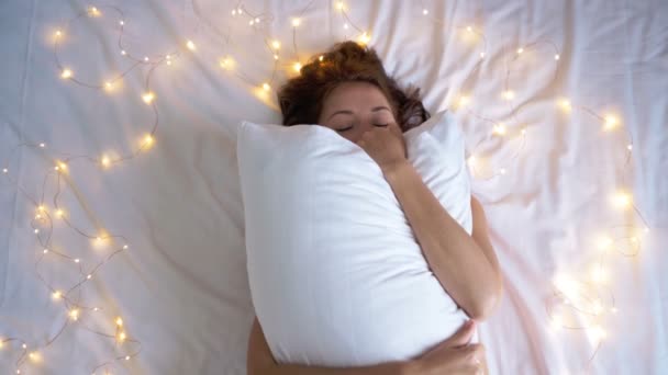 3 in 1 video. sleepy girl covering face with pillow. Playing with pillow on bed — Stock Video