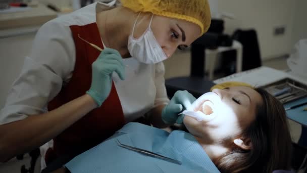 A Dentist at work with patient — Stock Video