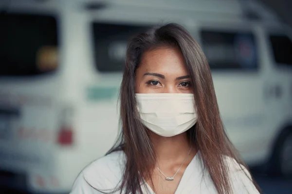Young beautiful Asian woman or hospital nurse using protective medical face mask — Stockfoto