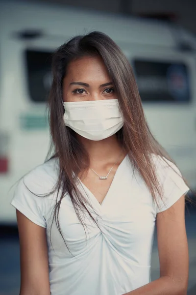 Young beautiful Asian woman or hospital nurse using protective medical face mask — Stockfoto