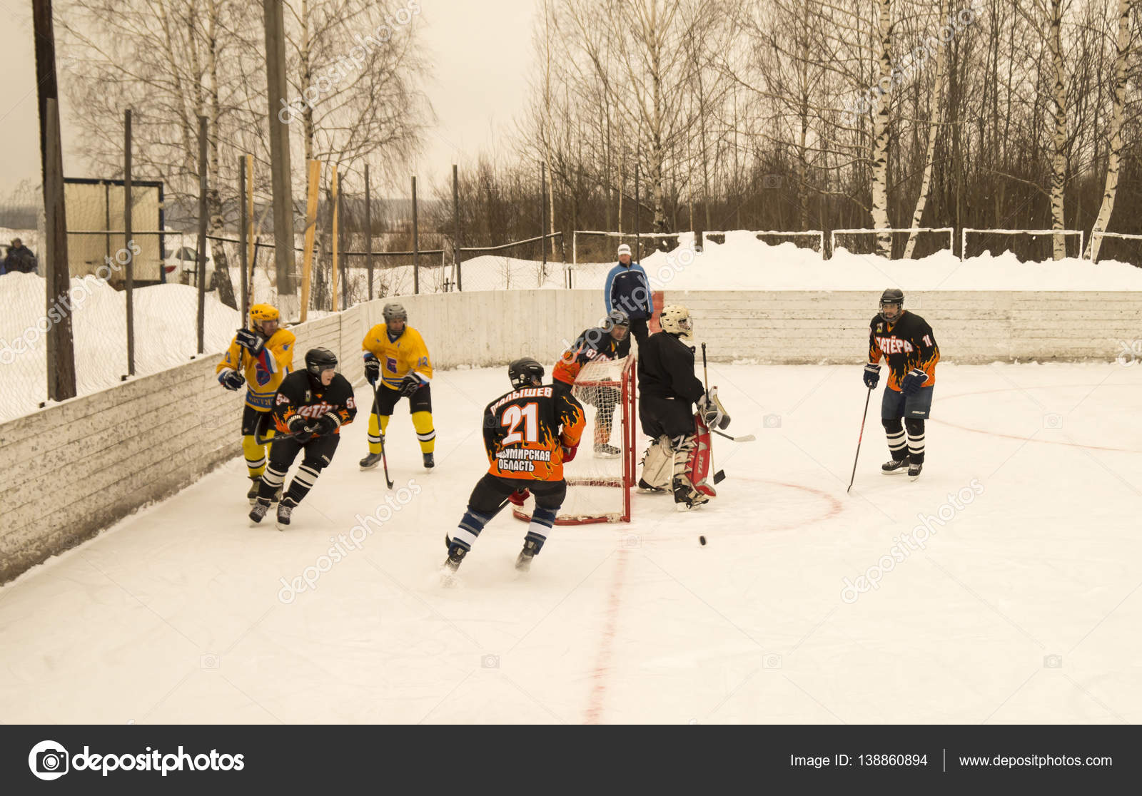 Game of hockey on ice platform under opened by sky Stock Editorial