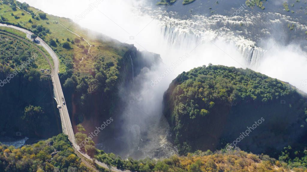 View from the air to the Victoria Falls, border bridge between Zambia and Zimbabwe over a canyon