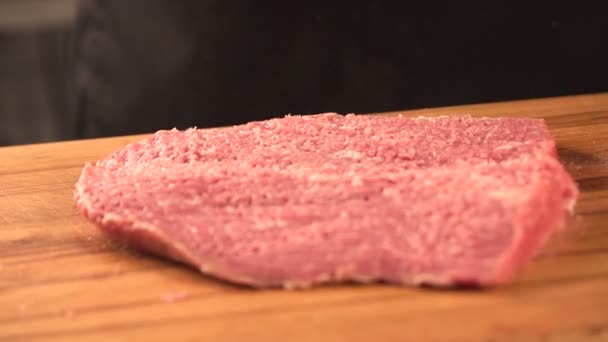 Large juicy piece of meat on a chalkboard. farm products — Stock Video