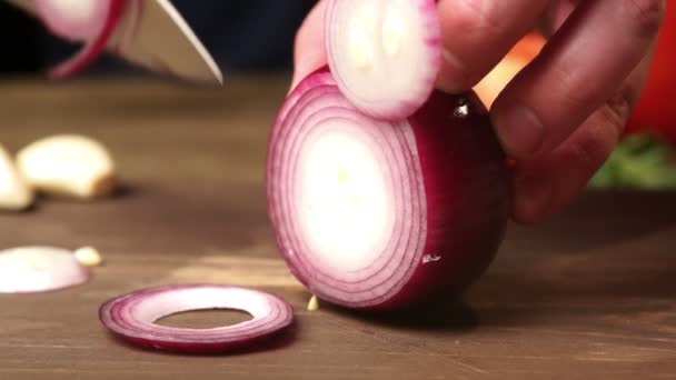 The chef hands slicing red onion by knife slowmo — Stock Video