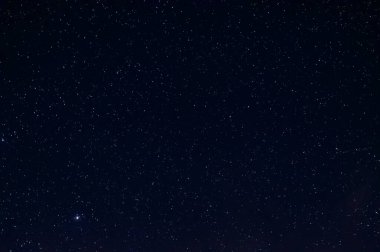 Long exposure night photo of a bright stars. A lot of stars with constellations. Far from the city. Night landscape. clipart