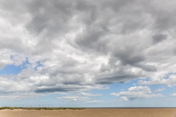 Cloud cluster on a lonely beach in England