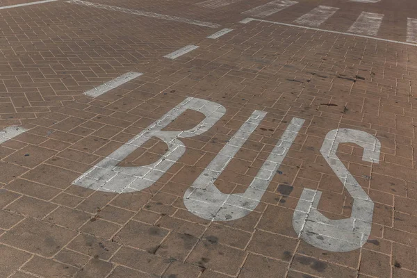 Bus signal painted on the ground