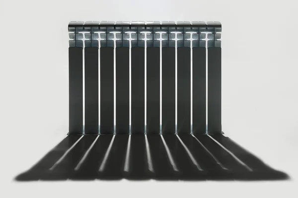 Heat radiator in dramatic lighting with shadow — Stock Photo, Image