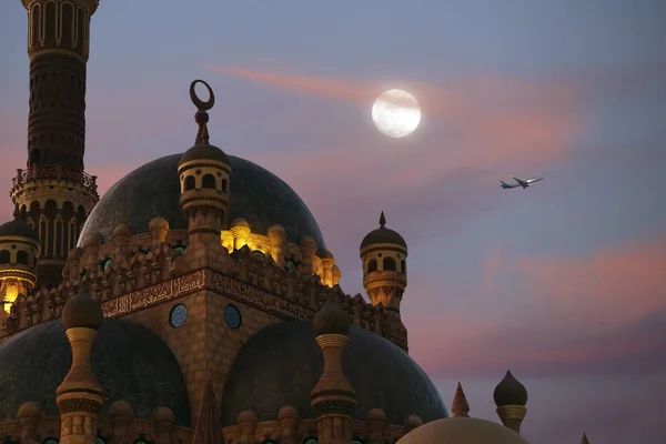 L'avion vole sur fond de lune, mosquée — Photo