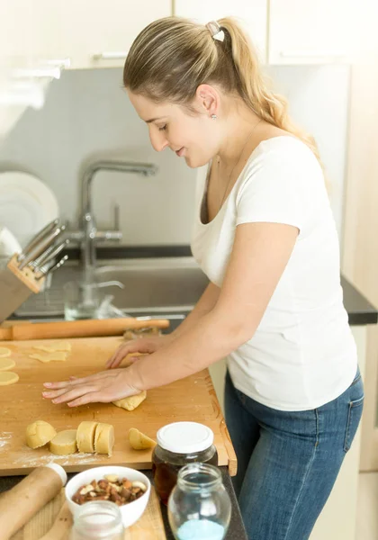 Portrait of housewife making dough on kitchen — Stock Photo, Image