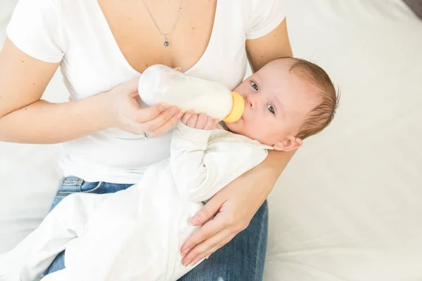 Portrait of adorable baby boy drinking milk from bottle — Stock Photo, Image