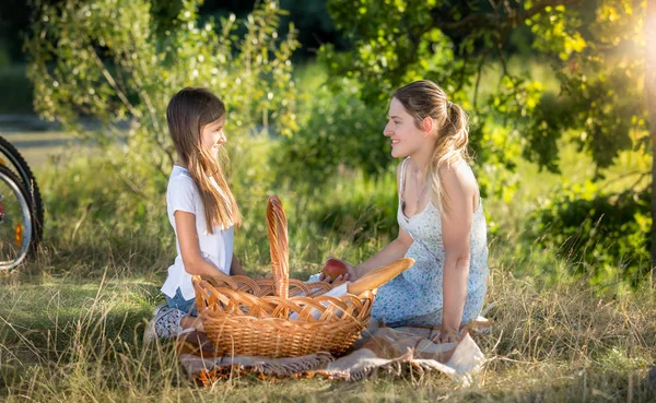 Happy family having picnic by the river — Stock Photo, Image