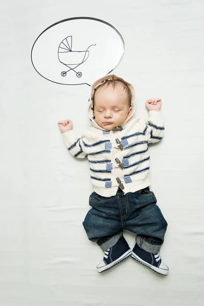 Cute 1 months old baby boy thinking of pram — Stock Photo, Image