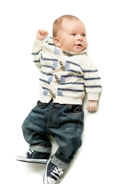 Cute smiling baby boy lying on bed — Stock Photo, Image