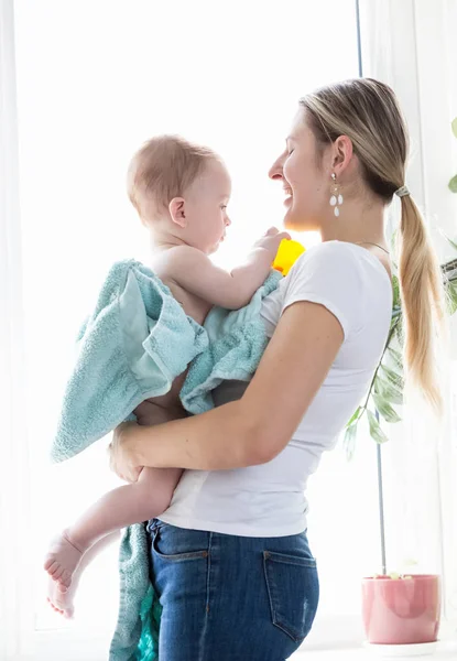 Happy young mother with baby boy after bathing — Stock Photo, Image