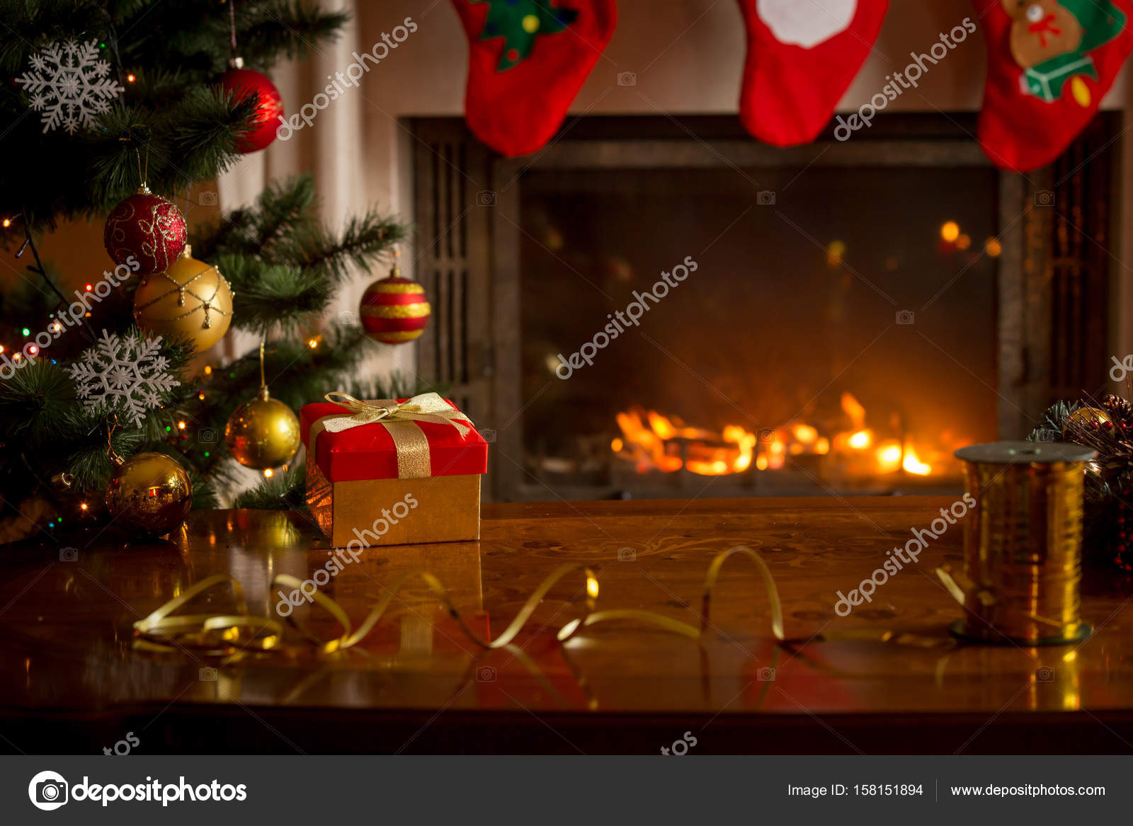 Christmas background with burning fireplace, Christmas tree, gif Stock  Photo by ©Kryzhov 158151894