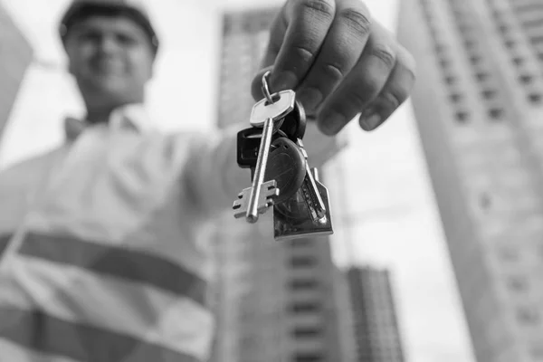 Black and white portrait of young smiling construction engineer — Stock Photo, Image