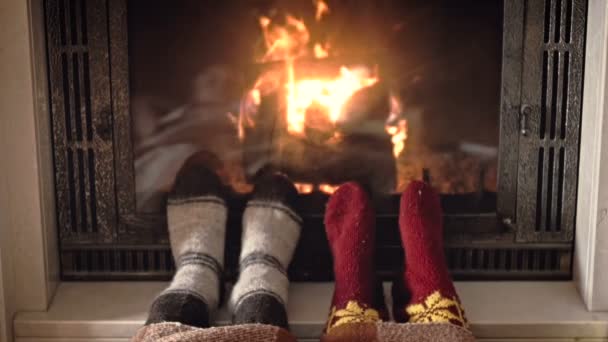 Slow motion footage of romantic young couple relaxing by the fireplace at house — Stock Video