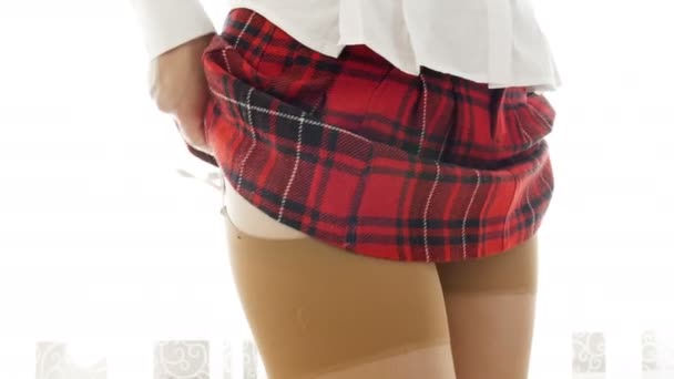 Closeup 4k footage of sexy student girl in stockings and red checkered skirt taking off lace panties — Stock Video