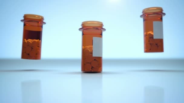 Vídeo CGI realista en 3D de tres envases con pastillas médicas que caen sobre fondo azul brillante — Vídeo de stock