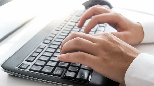 Macro photo of beautiful female hands pressing buttons on keyboard — Stock Photo, Image