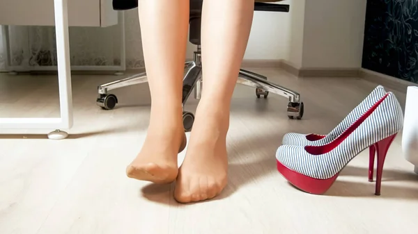 Closeup photo of female feet relaxing after hardworking day in office — Stock Photo, Image