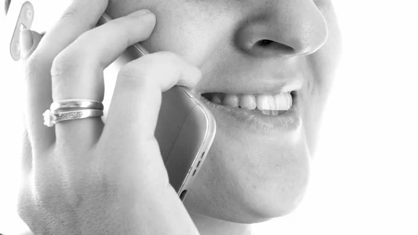 Black and white closeup photo of young woman talking by cell phone — Stock Photo, Image