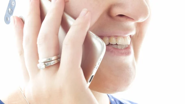 Extreme closeup photo of cheerful smiling woman talking by mobile phone — Stock Photo, Image