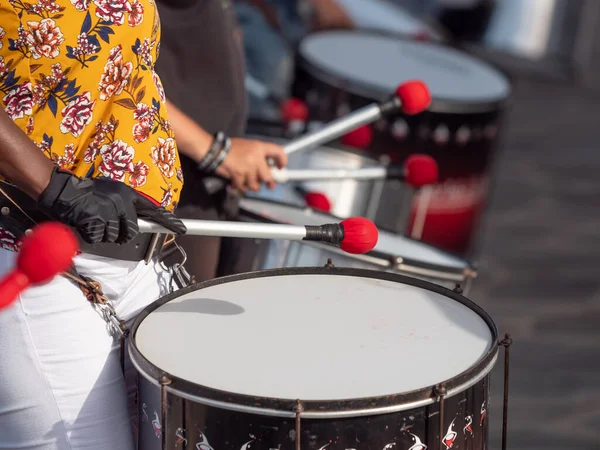 Closeup photo of group of musician playing on drums during party or carnival — Stock Photo, Image