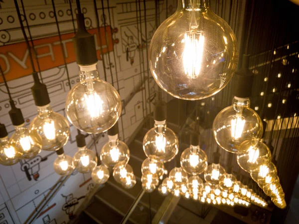 Macro image of decorative incandescent light bulbs hanging in modern interior — Stock Photo, Image