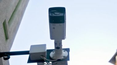 4k closeup video of surveillance video camera monitoring safety on city street