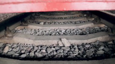 4k video of moving underneath old vintage steam locomotive on railroad station