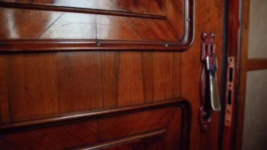 4k video of old wooden door sliding and opening luxury train coupe in vintage retro express