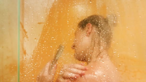 Closeup 4k video of sexy young woman touching her body while having shower — Stockvideo