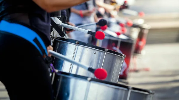 Closeup image of street musical band of drummers playing on street — Stock Photo, Image