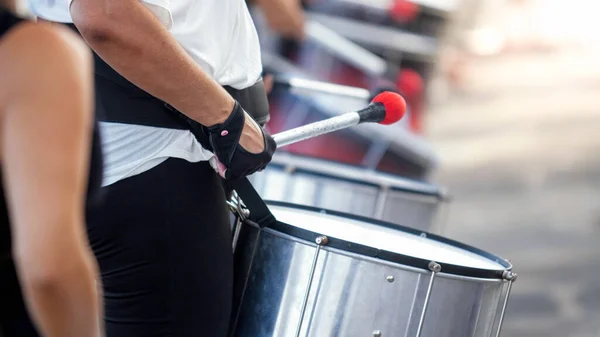 Closeup photo of street musician band playing on drums on city street — Stock Photo, Image
