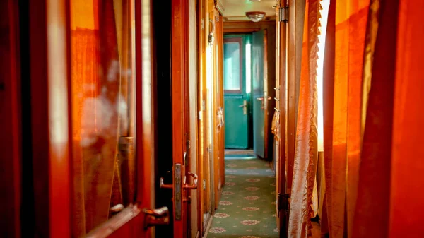 Interior of long hallway in old retro wooden train car