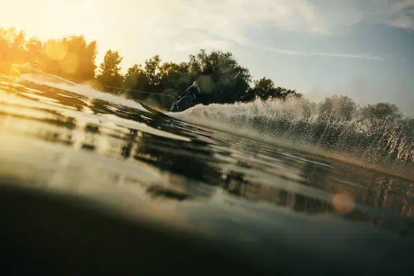 Man water skiing at sunset — Stock Photo, Image