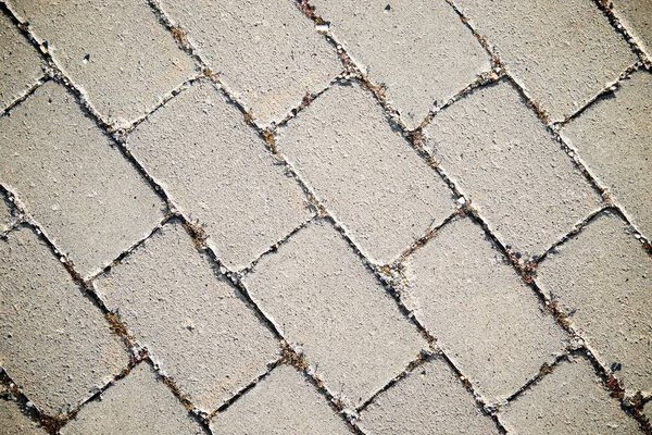 Floor of a street with stone tiles.