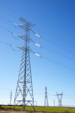 Power line and clear sky in Zaragoza province, Aragon in Spain. clipart