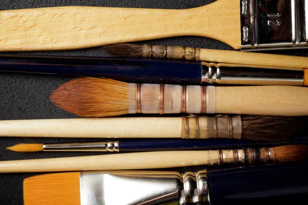 Paintbrushes Black Table — Stock Photo, Image