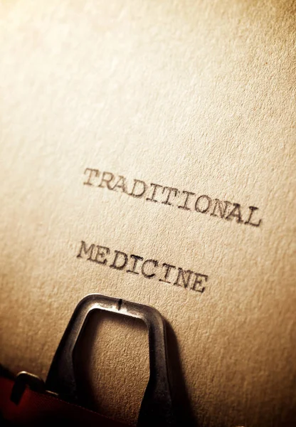Traditional medicine text written on a paper.