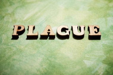 Yeşil bir kağıtta veba kelimesi.