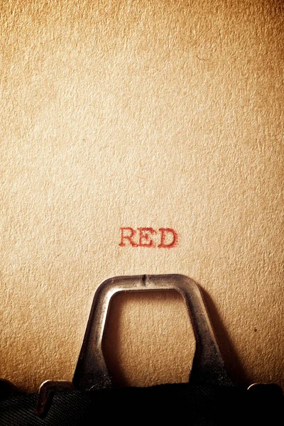 Red word written on a paper.
