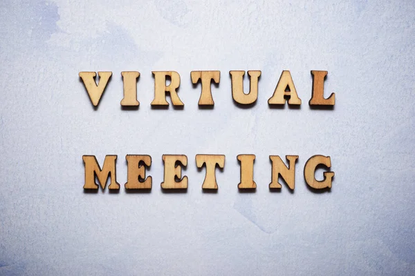 Virtual meeting text in a colored paper.