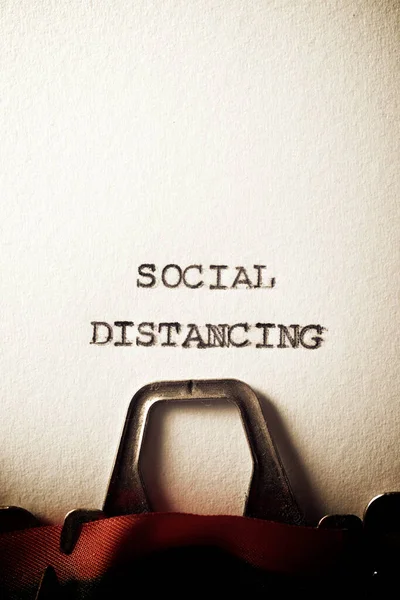 Social distancing text written with a typewriter.