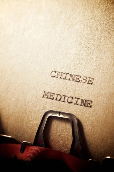 Chinese medicine text written on a paper.