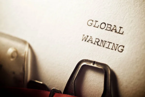 Global warning text written with a typewriter.